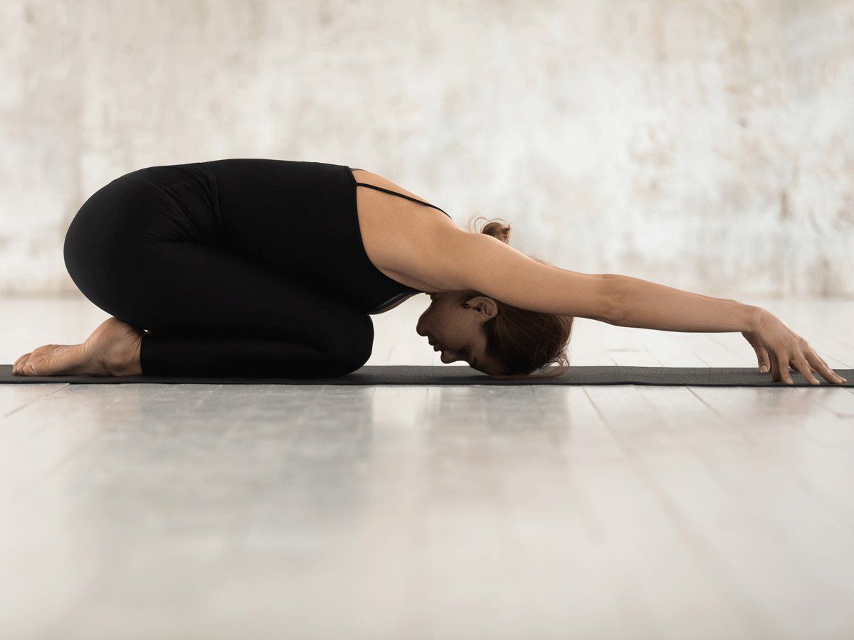 A lady practicing Child pose to increase stamina