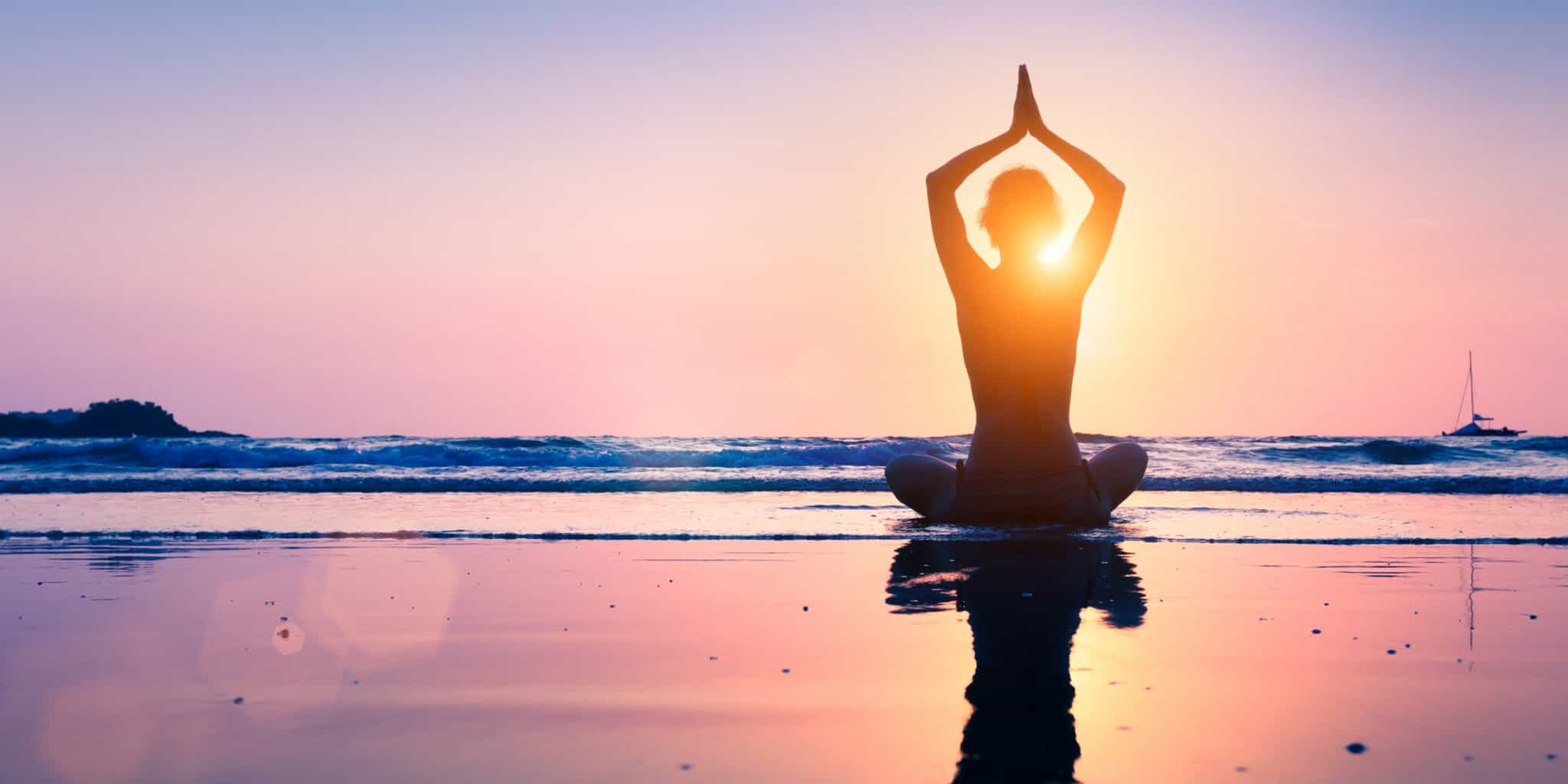 a women do Mindfulness Meditation in sunset